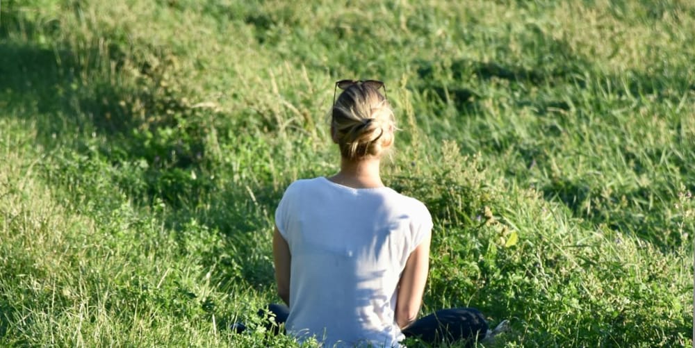 a female sitting-peacefully